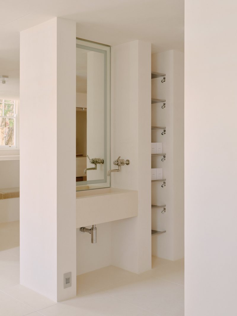 White bathroom vanity with steel towel rails